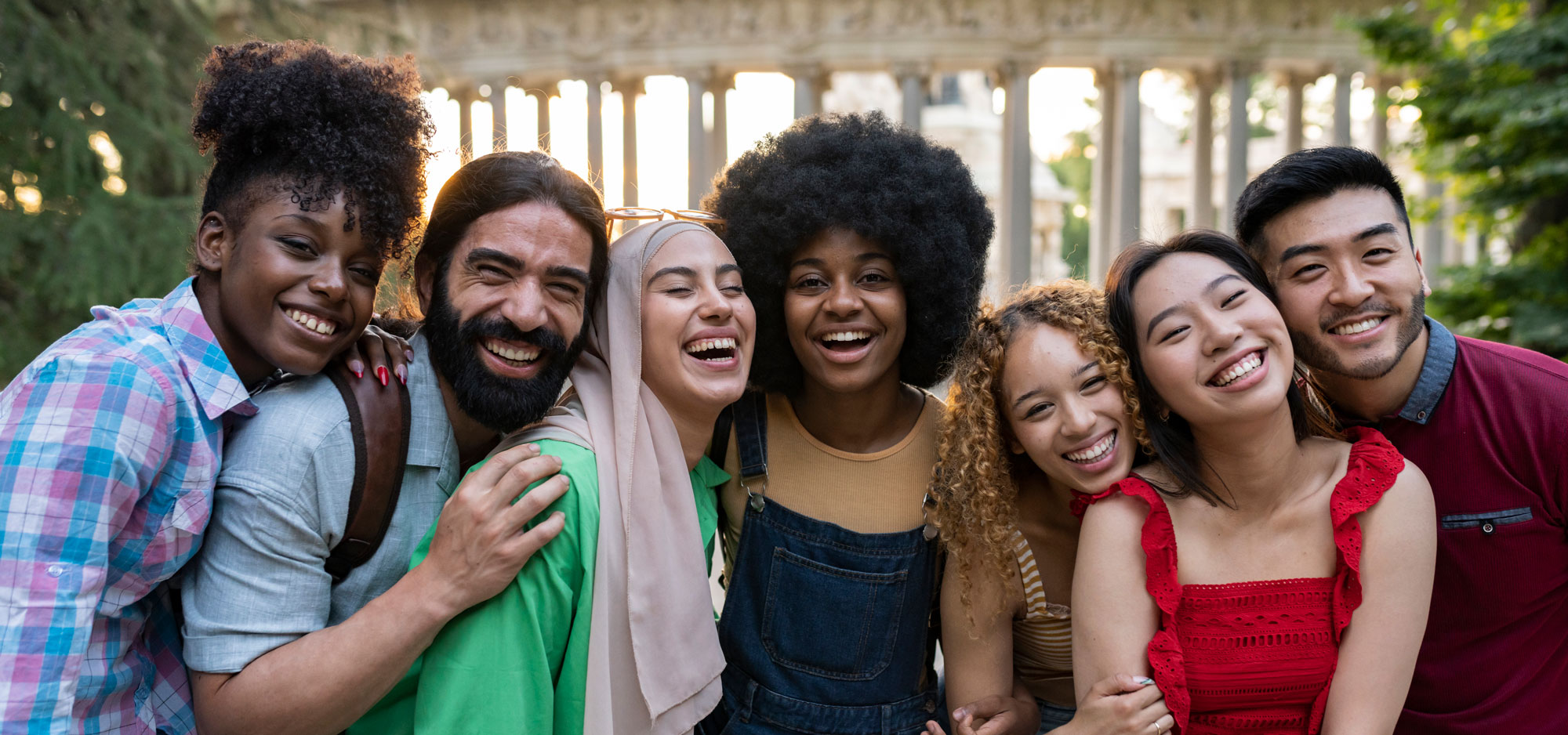 Young Adults looking at camera and laughing